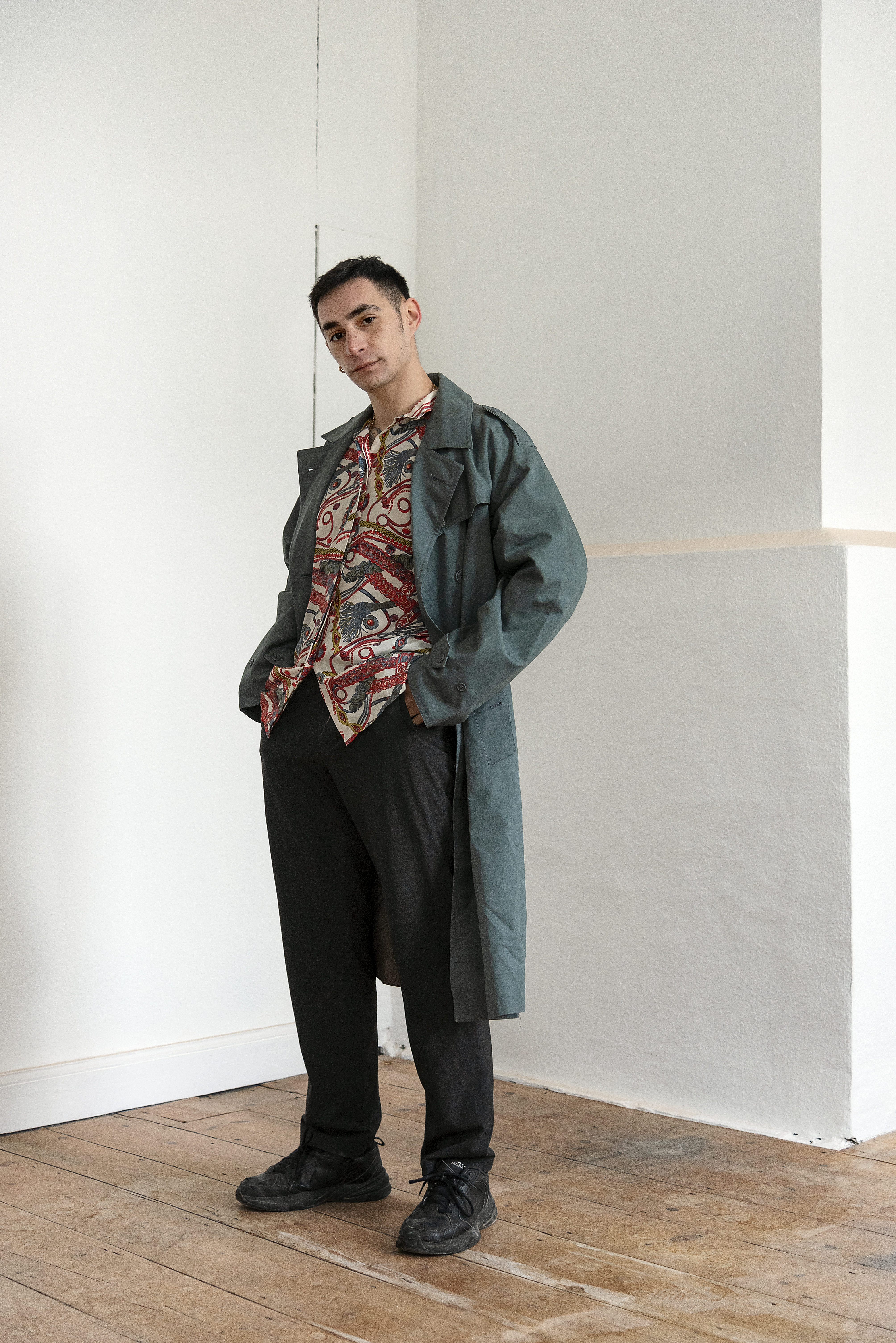 diplomat standing with long coat